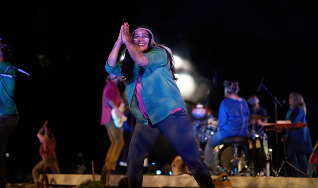 Close up of a Noongar artist dancing at Song Circle, EverNow 2024. Other performers are in the background. 